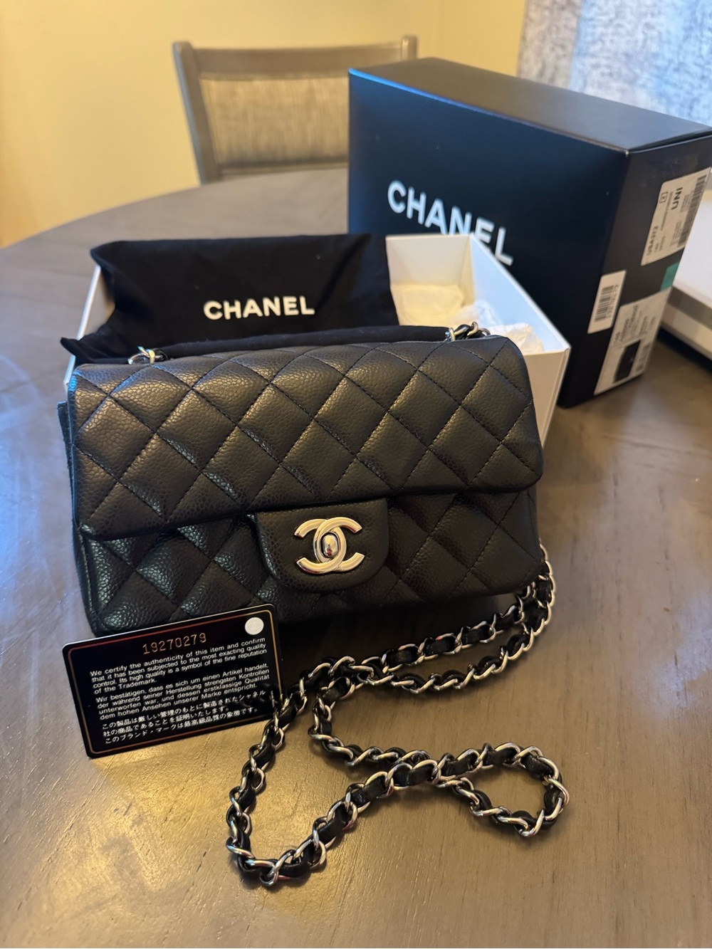 CHANEL Black Quilted Caviar Leather Mini Flap Crossbody with Silver Hardware